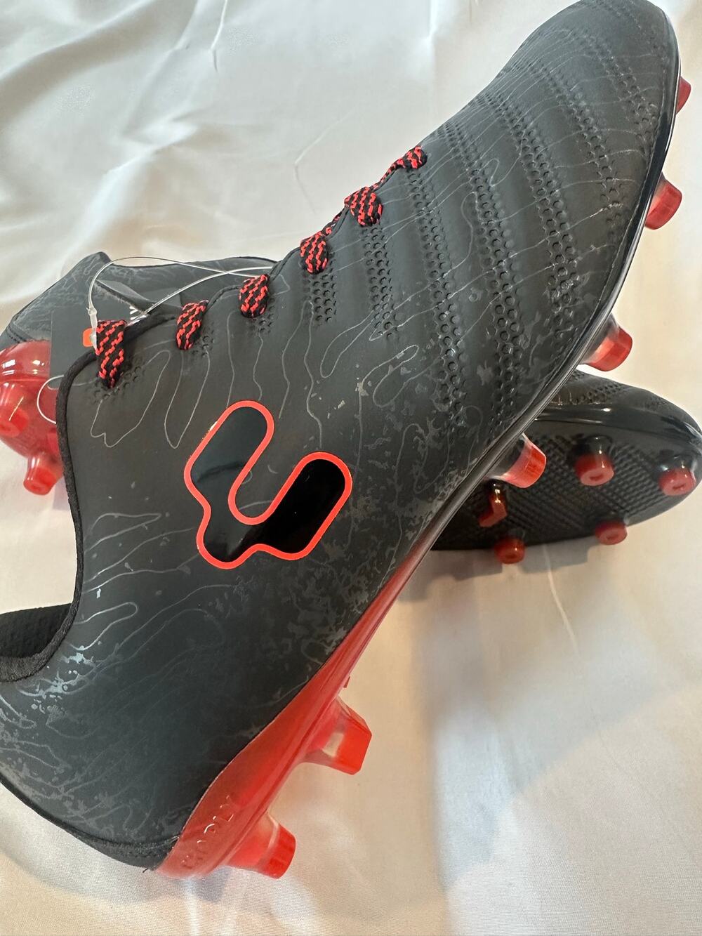 CHARLY soccer cleats size 7, Black with red accent